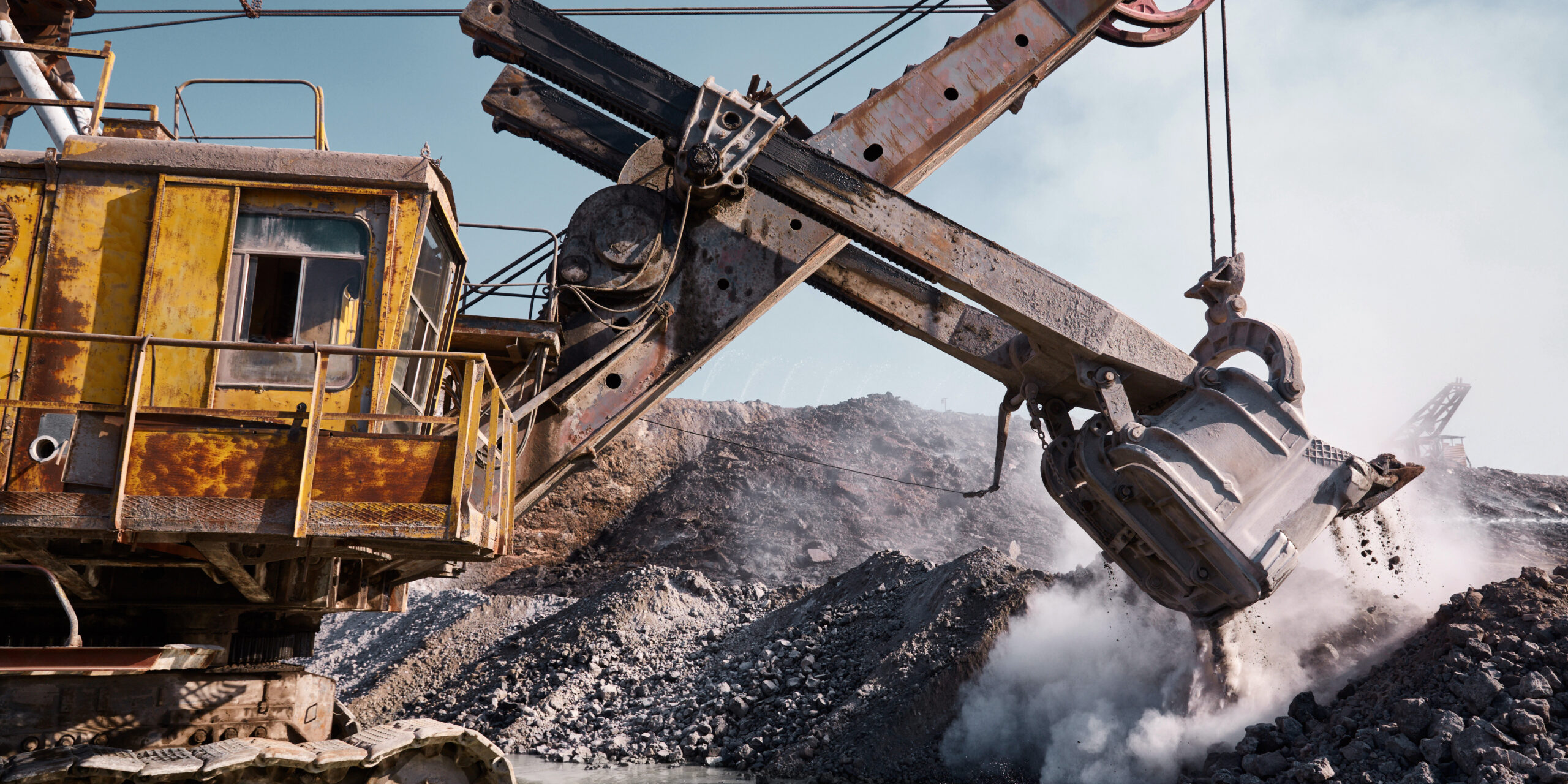 Quarry bucket excavator works in a slag dump